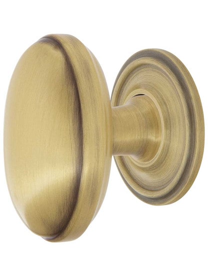 Homestead Cabinet Knob - 1 1/8 inch x 1 3/4 inch with Classic Rosette in Antique Brass.